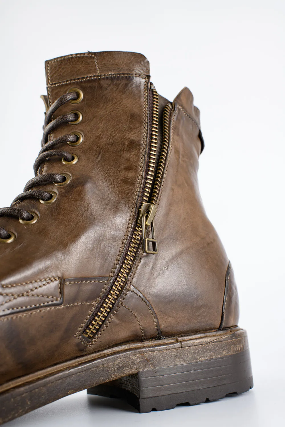 CURZON husk-brown military boots.
