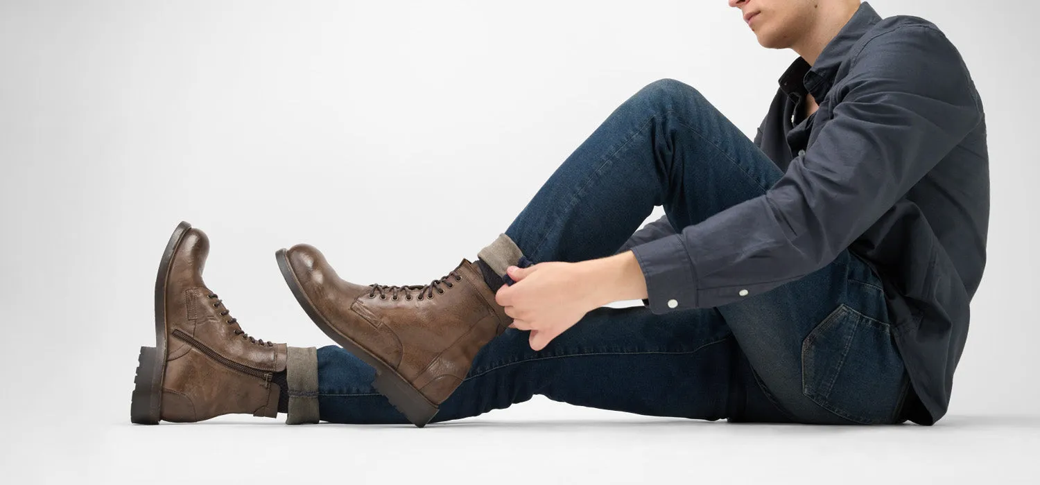 CURZON husk-brown military boots.