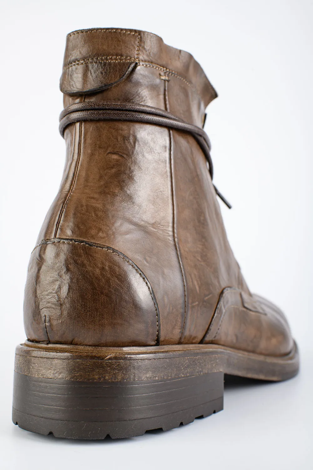 CURZON husk-brown military boots.