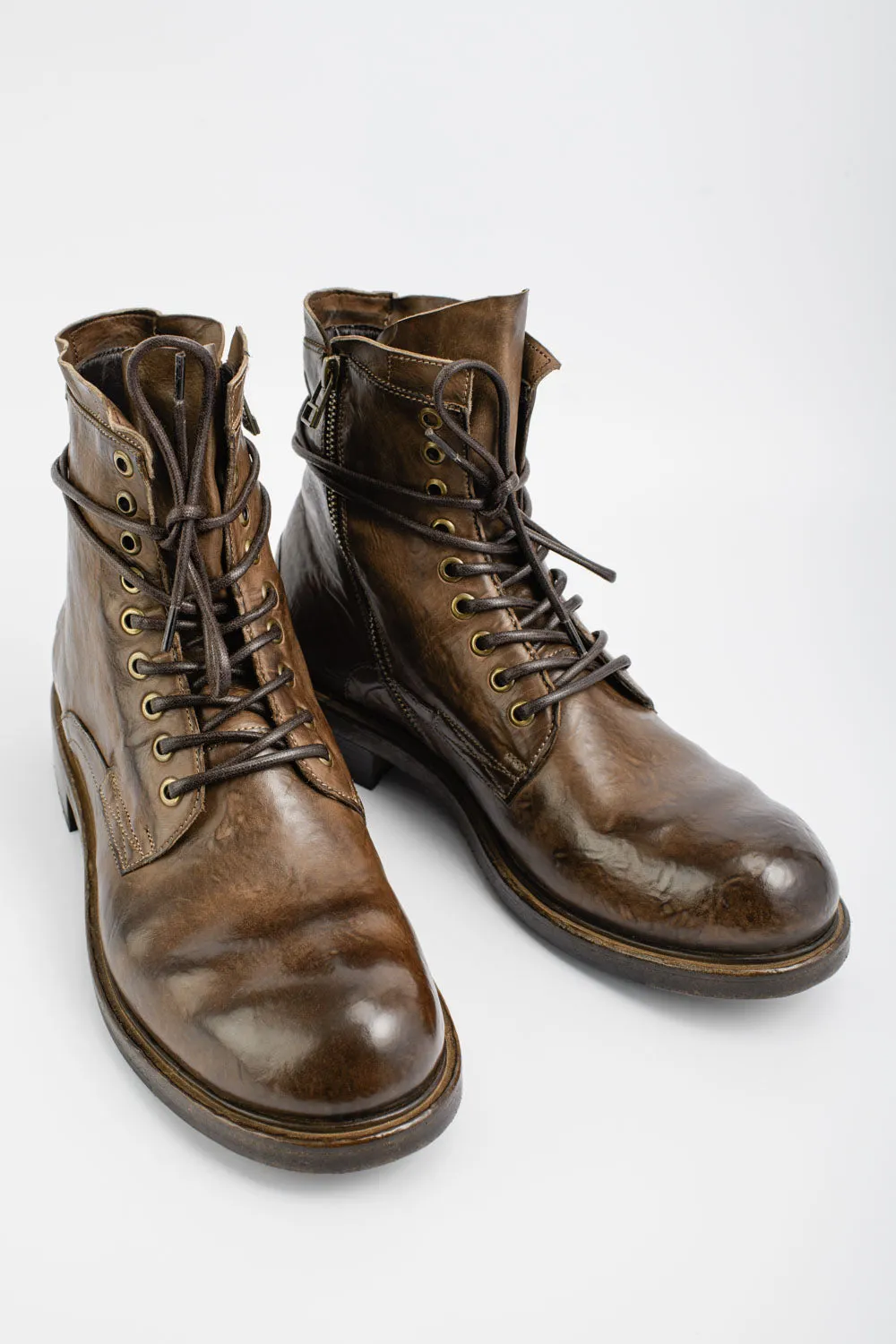 CURZON husk-brown military boots.