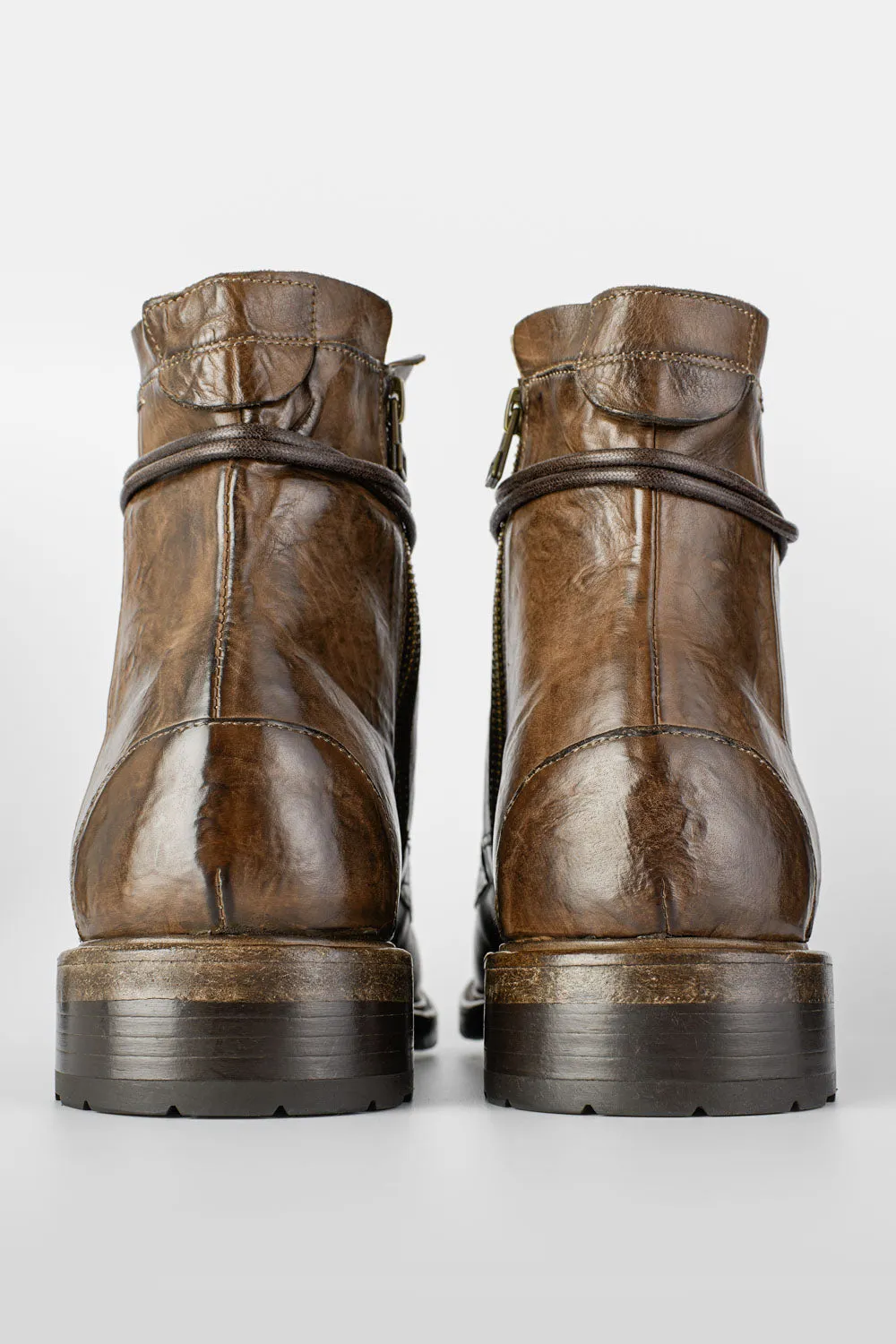 CURZON husk-brown military boots.